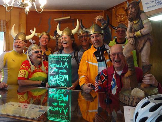 group of people laughing at a bar